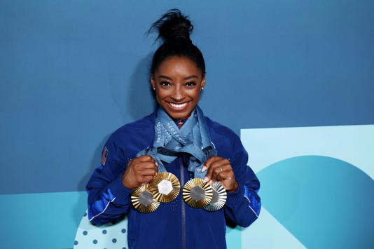 Simone Biles’ estranged birth mum begs Olympic icon to get in touch after abandoning her