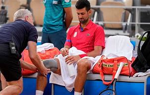 Novak Djokovic is concerned about knee pain at Paris Olympics after a win over Tsitsipas